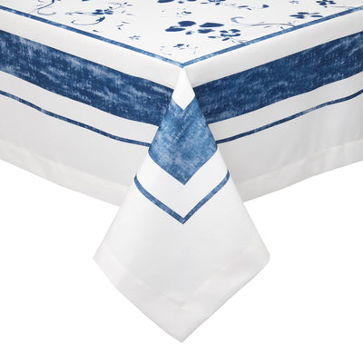 Shades of indigo paint a scene of wild flowers over crisp white linen-like fabric. The Naples tablecloth exudes effortless style– timeless, simple and chic– perfect for outdoor dining.