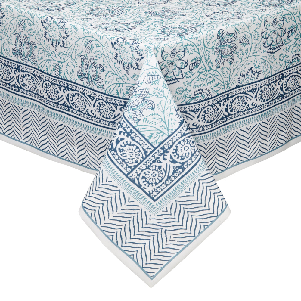Let patterns play on the Tulum tablecloth. A classic blue and white color palette anchors a festive juxtaposition of stripes, swirls, flowers and vines.